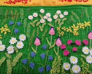 close up of flowers on quilt